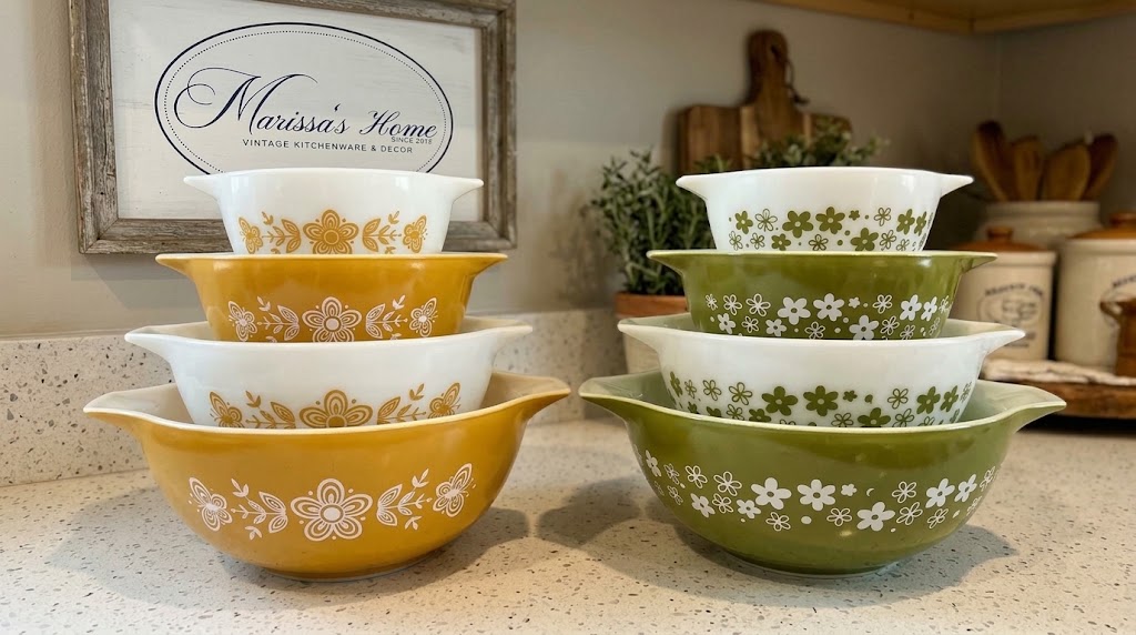 Butterfly Gold and Spring Blossom Pyrex Cinderella mixing bowl sets stacked side by side